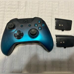 Xbox controller with 2 rechargeable batteries.